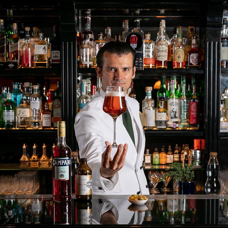 Bartender Erik Lorincz holding a Campari cocktail