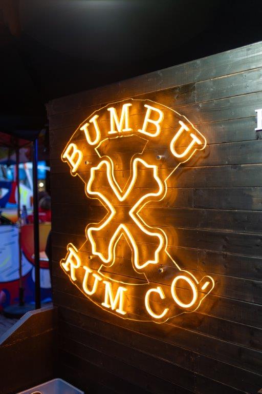 The Bumbu Rum logo in neon at London Cocktail Week